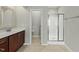 Bathroom featuring a large vanity, framed mirror, and glass door shower at 245 Kylemore Cir, Cary, NC 27513