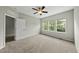 Bright bedroom with three windows and neutral decor, offering a serene and inviting space at 245 Kylemore Cir, Cary, NC 27513
