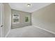 Bedroom with soft carpet, natural light, and neutral wall color at 245 Kylemore Cir, Cary, NC 27513