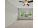 This spacious bedroom has three windows overlooking the backyard allowing for generous light to fill the room at 245 Kylemore Cir, Cary, NC 27513