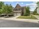 Charming brick home with attached garage, surrounded by a lush green lawn and mature trees at 245 Kylemore Cir, Cary, NC 27513