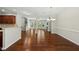 Bright open-concept layout with hardwood floors, fireplace, and easy access to outdoor patio at 245 Kylemore Cir, Cary, NC 27513
