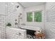 Bathroom featuring a clawfoot tub and subway tile shower at 2508 Sevier St, Durham, NC 27705