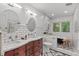 Bathroom with double sinks, subway tile, and a black soaking tub at 2508 Sevier St, Durham, NC 27705