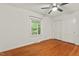 Bedroom featuring a window, hardwood floors, and a closet at 2508 Sevier St, Durham, NC 27705
