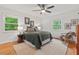Serene bedroom featuring natural light, hardwood floors, and a ceiling fan at 2508 Sevier St, Durham, NC 27705