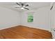 Bedroom featuring a ceiling fan, hardwood floors, and a window at 2508 Sevier St, Durham, NC 27705