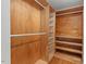 Walk-in closet featuring built-in shelves and rods for hanging clothes at 2508 Sevier St, Durham, NC 27705