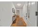 Bright entryway featuring hardwood floors, white walls, and stylish console table at 2508 Sevier St, Durham, NC 27705