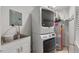 Efficient laundry room with modern washer and dryer, utility sink and ample storage space at 2508 Sevier St, Durham, NC 27705