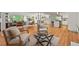 Open-concept living space features hardwood floors, neutral decor, and ample natural light at 2508 Sevier St, Durham, NC 27705