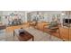 Bright, open-concept living and dining area with hardwood floors and modern furnishings at 2508 Sevier St, Durham, NC 27705