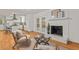 Cozy living room area with fireplace, hardwood floors, and neutral decor at 2508 Sevier St, Durham, NC 27705