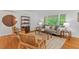 Inviting living room with hardwood floors, stylish decor, and large windows for natural light at 2508 Sevier St, Durham, NC 27705