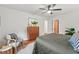 Bright main bedroom featuring a ceiling fan, hardwood floors, and a closet at 2508 Sevier St, Durham, NC 27705