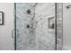 Close up on shower featuring a rainfall shower head and shower niche at 2508 Sevier St, Durham, NC 27705