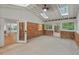 Bright sunroom with skylights, exposed brick, and multiple windows, perfect for year-round enjoyment at 2508 Sevier St, Durham, NC 27705