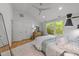 Bright bedroom with hardwood floors, ceiling fan, and double closets for extra storage space at 2529 Remington Rd, Raleigh, NC 27610