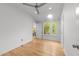 Bedroom features wood floors, a ceiling fan, lots of natural light, and access to a bathroom at 2529 Remington Rd, Raleigh, NC 27610
