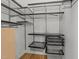Walk-in closet with custom shelving and drawers for optimal organization and storage at 2529 Remington Rd, Raleigh, NC 27610