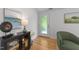 Bright entryway with hardwood floors, stylish decor, and a door leading to the outdoors at 2529 Remington Rd, Raleigh, NC 27610