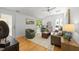Well-lit living room featuring vaulted ceiling, hardwood flooring, and contemporary furnishings at 2529 Remington Rd, Raleigh, NC 27610