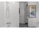 Modern shower with white subway tile, chrome fixtures, and built-in shelves for toiletries at 2529 Remington Rd, Raleigh, NC 27610