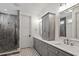Bathroom featuring double sink vanity, tile floor, and glass shower at 2613 Bedford Ave, Raleigh, NC 27607