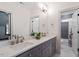 Bright bathroom featuring a double vanity with modern fixtures and marble floors at 2613 Bedford Ave, Raleigh, NC 27607