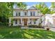 Charming two-story home with a welcoming front porch and lush green lawn at 2613 Bedford Ave, Raleigh, NC 27607