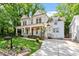 Beautiful two-story home featuring a covered porch, landscaped garden, and driveway at 2613 Bedford Ave, Raleigh, NC 27607