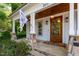 Close-up of the front porch showcasing stone accents and a wooden front door at 2613 Bedford Ave, Raleigh, NC 27607