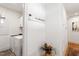 Hallway with laundry area featuring white washer and dryer at 2613 Bedford Ave, Raleigh, NC 27607