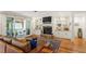 Cozy living room with built-in shelves, fireplace, and access to an outdoor patio at 2613 Bedford Ave, Raleigh, NC 27607