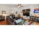 Spacious living room with hardwood floors, comfortable seating, and access to an outdoor space at 2613 Bedford Ave, Raleigh, NC 27607