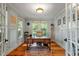 Stylish home office with hardwood floors, natural light, and wood accents at 2613 Bedford Ave, Raleigh, NC 27607