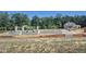 New home construction featuring a block foundation on a wooded lot at 264 Alden Way, Angier, NC 27501
