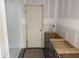Bathroom featuring a white shower and dark cabinets, offering a modern and functional space at 2868 Quarry Rd # 167, Rolesville, NC 27571
