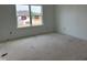 Unfinished bedroom featuring a large window overlooking the front yard at 2868 Quarry Rd # 167, Rolesville, NC 27571