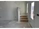 Entryway showcasing stairs to the upper level and a bright doorway to the home's exterior at 2868 Quarry Rd # 167, Rolesville, NC 27571