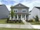 Charming two-story home boasts a well-manicured lawn and classic architectural details at 2868 Quarry Rd # 167, Rolesville, NC 27571
