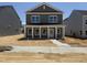 Charming two-story home featuring a covered front porch and classic architectural details, offering an inviting curb appeal at 2868 Quarry Rd # 167, Rolesville, NC 27571