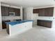 Spacious kitchen with dark cabinets, modern appliances, and ample counter space for cooking and entertaining at 2868 Quarry Rd # 167, Rolesville, NC 27571