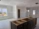 A spacious kitchen showcasing dark cabinets and a large island, providing ample space for culinary creations at 2868 Quarry Rd # 167, Rolesville, NC 27571