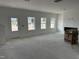 Spacious living room showcasing a fireplace and several windows for abundant light at 2868 Quarry Rd # 167, Rolesville, NC 27571