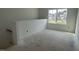 Bright loft area with a large window, offering a view of the surrounding neighborhood at 2868 Quarry Rd # 167, Rolesville, NC 27571