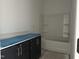Well-lit bathroom boasts dark cabinetry and a modern bathtub with shower at 2872 Quarry Rd # 166, Rolesville, NC 27571