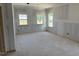 Bedroom with natural light from three windows, ready for customization at 2872 Quarry Rd # 166, Rolesville, NC 27571