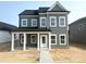 New construction two story home with gray siding and black roof at 2872 Quarry Rd # 166, Rolesville, NC 27571