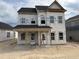 New construction, two-story home with covered porch, and awaiting finishing touches at 2872 Quarry Rd # 166, Rolesville, NC 27571